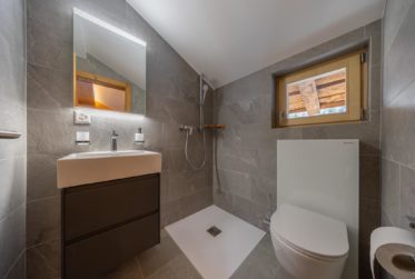Authentic renovated log mazot in the centre of the resort